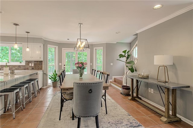 601 NW 41st St, Kansas City, MO 64116 - dining room featuring light tile patterned floors, crown molding, recessed lighting, and baseboards