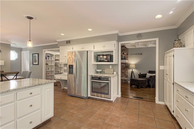 601 NW 41st St, Kansas City, MO 64116 - kitchen featuring appliances with stainless steel finishes, crown molding, white cabinetry, pendant lighting, and light stone counters