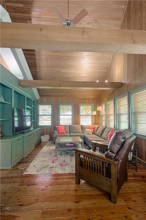 601 NW 41st St, Kansas City, MO 64116 - living room with vaulted ceiling, wood walls, wooden ceiling, healthy amount of natural light, and hardwood / wood-style flooring