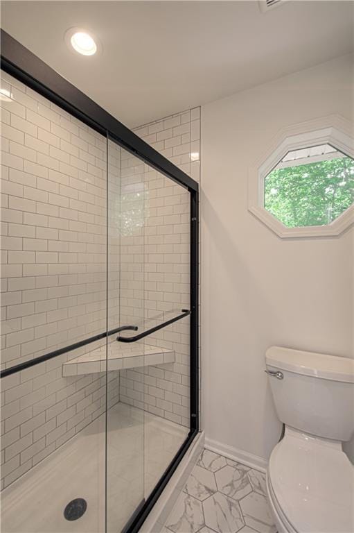 601 NW 41st St, Kansas City, MO 64116 - full bathroom featuring toilet, marble look tile flooring, a shower stall, baseboards, and recessed lighting