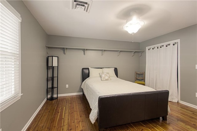 601 NW 41st St, Kansas City, MO 64116 - bedroom with dark wood-type flooring and baseboards