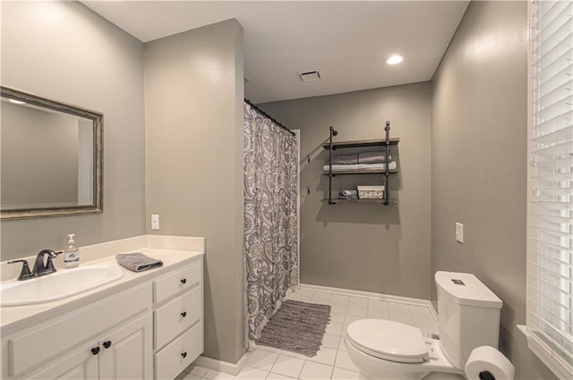 601 NW 41st St, Kansas City, MO 64116 - bathroom with toilet, vanity, tile patterned flooring, a shower with curtain, and baseboards