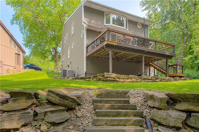 601 NW 41st St, Kansas City, MO 64116 - rear view of property featuring stairs, a deck, and a lawn