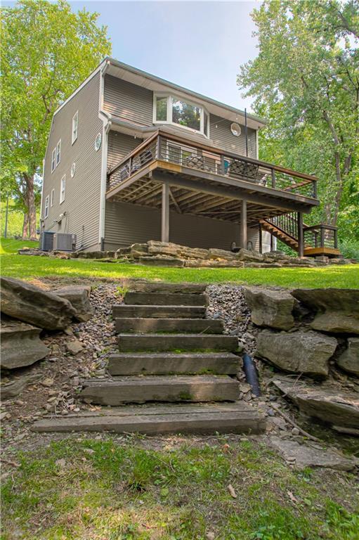 601 NW 41st St, Kansas City, MO 64116 - back of property with stairs and a deck