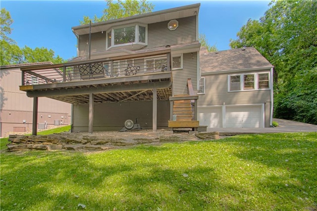 601 NW 41st St, Kansas City, MO 64116 - rear view of property with a garage, a yard, a wooden deck, and stairway