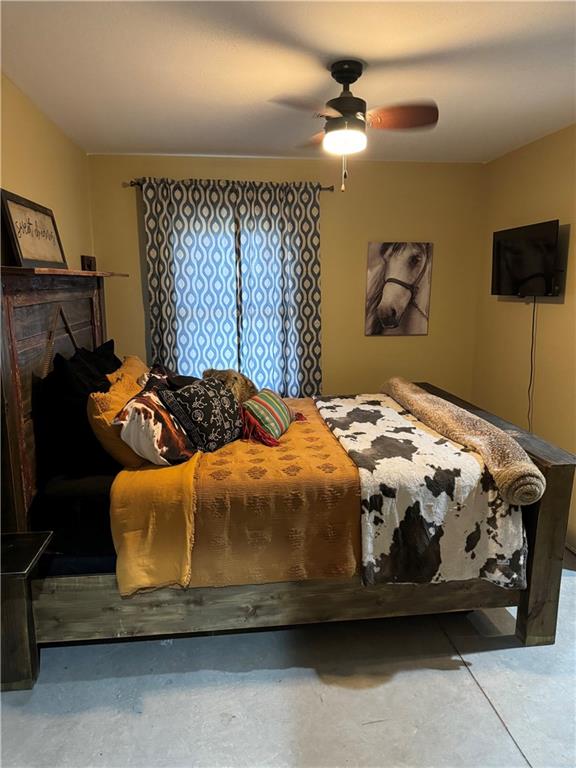 25332 E 250th Ave, Ridgeway, MO 64481 - bedroom with concrete floors and ceiling fan