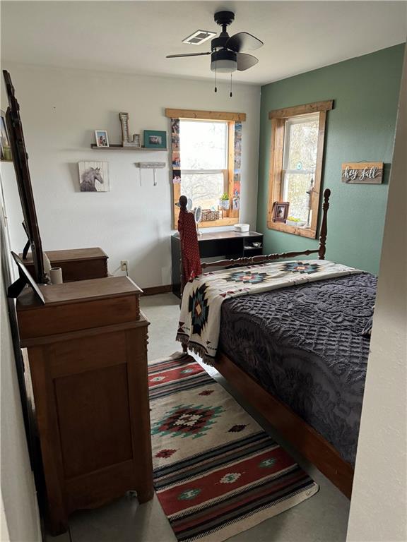 25332 E 250th Ave, Ridgeway, MO 64481 - bedroom with multiple windows and a ceiling fan