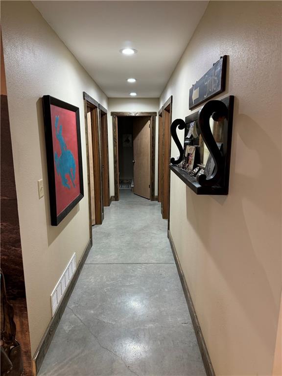 25332 E 250th Ave, Ridgeway, MO 64481 - hallway with concrete floors, recessed lighting, and baseboards