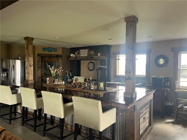 25332 E 250th Ave, Ridgeway, MO 64481 - kitchen with stainless steel refrigerator with ice dispenser and concrete flooring
