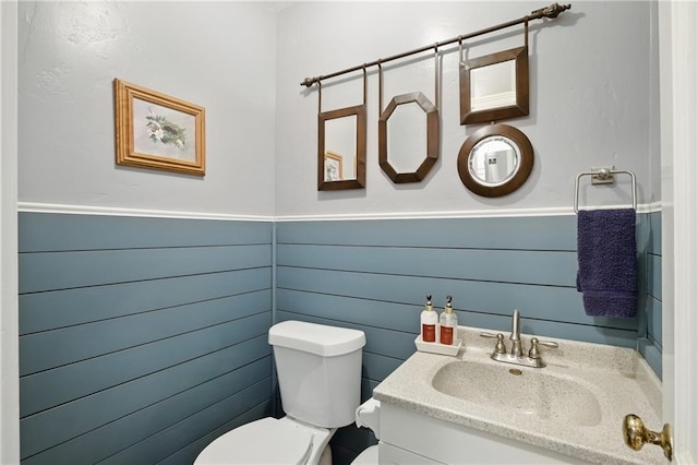 440 E 74th Ter, Kansas City, MO 64131 - half bath with toilet, vanity, and wainscoting