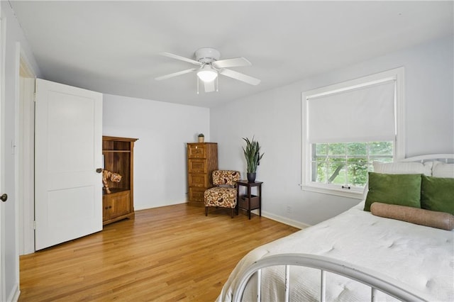 440 E 74th Ter, Kansas City, MO 64131 - bedroom featuring light wood finished floors and ceiling fan