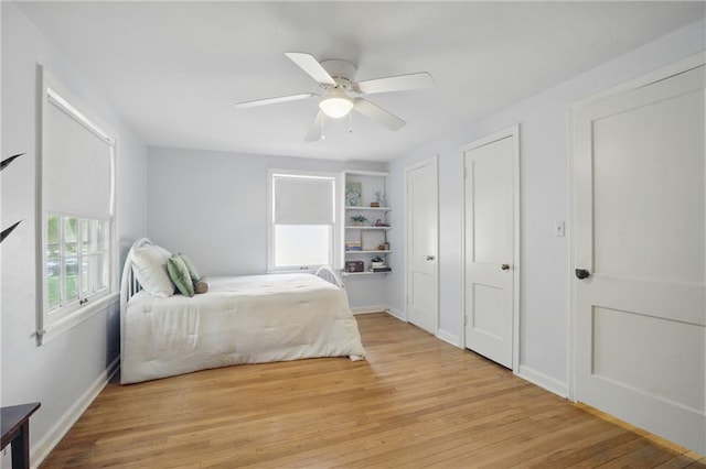 440 E 74th Ter, Kansas City, MO 64131 - bedroom with wood finished floors, baseboards, and a ceiling fan