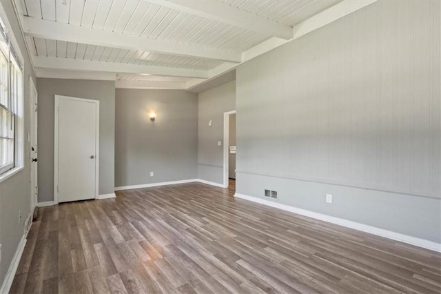 16 W 89th Ter, Kansas City, MO 64114 - empty room with beam ceiling, wood finished floors, and baseboards