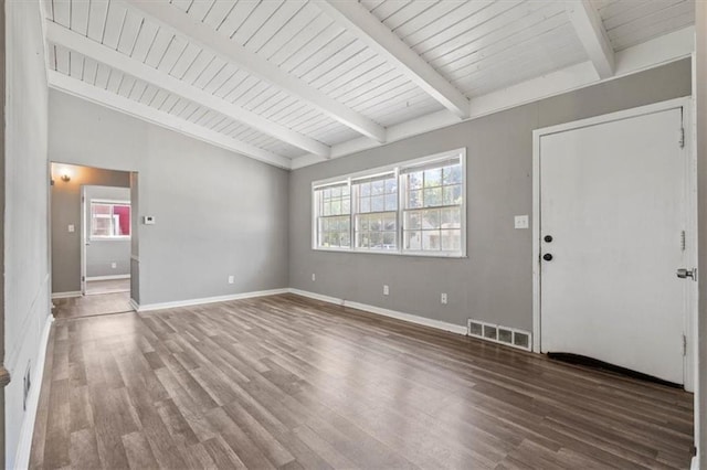 16 W 89th Ter, Kansas City, MO 64114 - unfurnished living room featuring wood finished floors, plenty of natural light, and baseboards