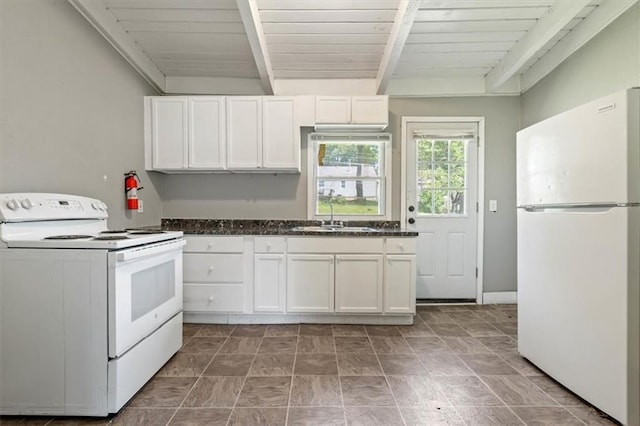 16 W 89th Ter, Kansas City, MO 64114 - kitchen featuring white appliances, a sink, white cabinets, stone finish floors, and dark stone counters