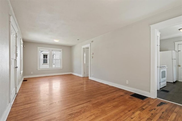 11412 E 20th St S, Independence, MO 64052 - spare room with light wood finished floors and baseboards