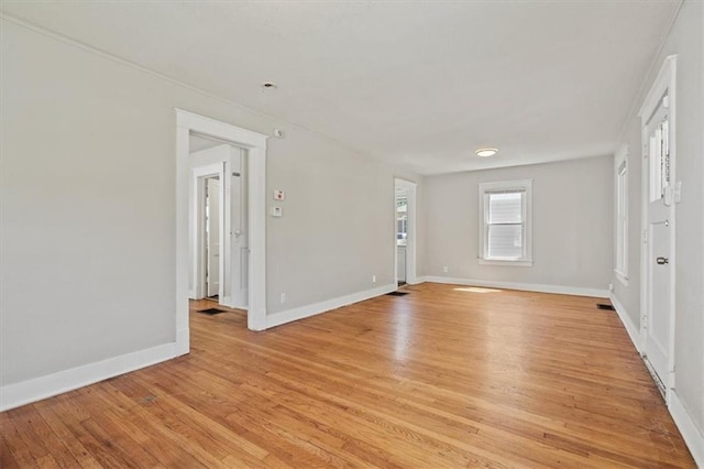 11412 E 20th St S, Independence, MO 64052 - empty room featuring light wood-style floors and baseboards