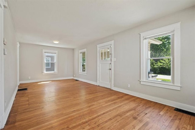 11412 E 20th St S, Independence, MO 64052 - foyer with light wood-style floors, plenty of natural light, and baseboards