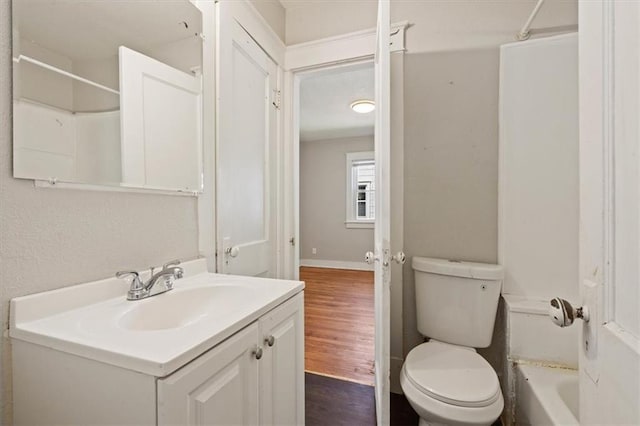 11412 E 20th St S, Independence, MO 64052 - full bathroom featuring toilet, vanity, a shower, wood finished floors, and a tub to relax in