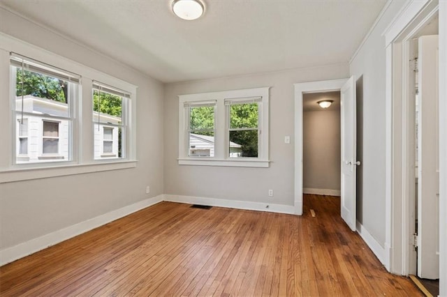 11412 E 20th St S, Independence, MO 64052 - empty room with hardwood / wood-style flooring and baseboards