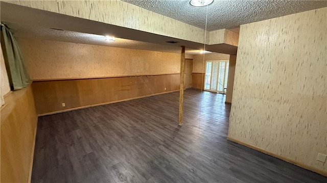 12909 E 40th St S, Independence, MO 64055 - unfurnished room with wood finished floors, a textured ceiling, and baseboards