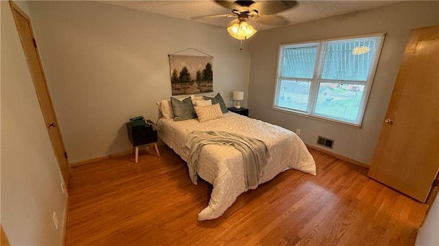 12909 E 40th St S, Independence, MO 64055 - bedroom featuring light wood-type flooring, baseboards, and ceiling fan