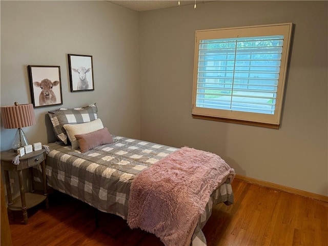 12909 E 40th St S, Independence, MO 64055 - bedroom with wood finished floors and baseboards