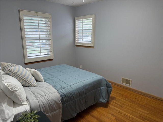 12909 E 40th St S, Independence, MO 64055 - bedroom featuring wood finished floors
