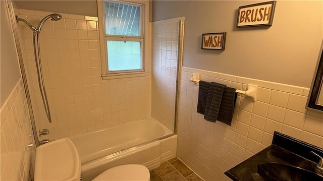 12909 E 40th St S, Independence, MO 64055 - full bathroom with toilet, tile walls, washtub / shower combination, wainscoting, and vanity