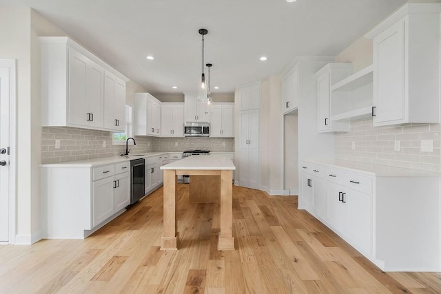 15443 W 171st Pl, Olathe, KS 66062 - kitchen featuring stainless steel appliances, open shelves, backsplash, light countertops, and recessed lighting