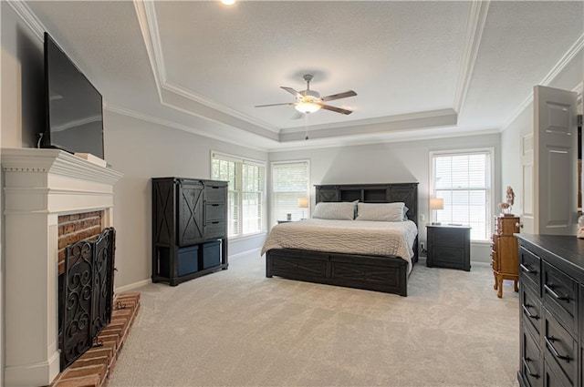 13125 Sherwood St, Leawood, KS 66209 - bedroom featuring a tray ceiling, crown molding, light carpet, multiple windows, and a fireplace