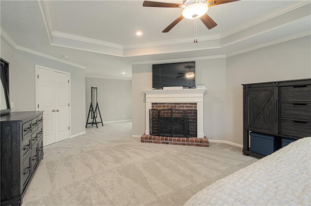 13125 Sherwood St, Leawood, KS 66209 - unfurnished bedroom featuring a tray ceiling, light colored carpet, crown molding, a fireplace, and ceiling fan