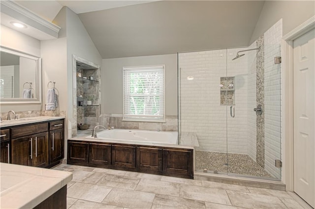 13125 Sherwood St, Leawood, KS 66209 - bathroom with vaulted ceiling, vanity, a garden tub, and a shower stall