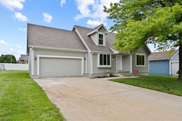 10118 E 220th St, Peculiar, MO 64078 - cape cod house with a garage, driveway, and a shingled roof