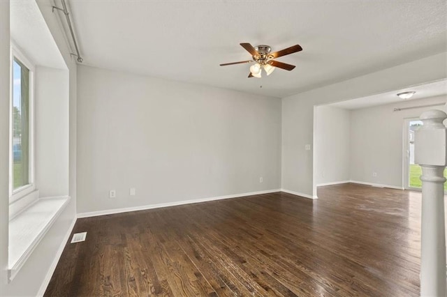 10118 E 220th St, Peculiar, MO 64078 - unfurnished room featuring dark wood finished floors, ceiling fan, and baseboards