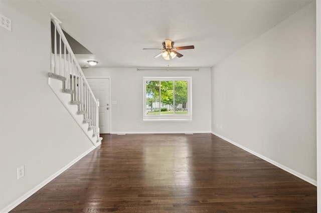 10118 E 220th St, Peculiar, MO 64078 - unfurnished living room with ceiling fan, stairs, wood finished floors, and baseboards