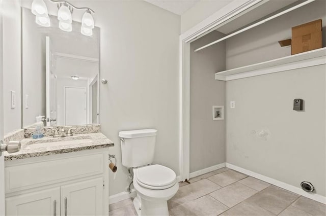 10118 E 220th St, Peculiar, MO 64078 - bathroom with vanity, toilet, tile patterned floors, and baseboards