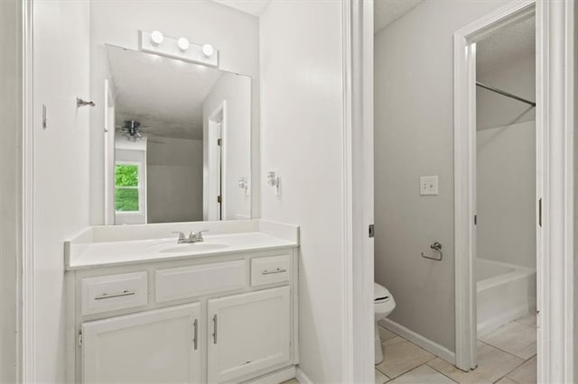 10118 E 220th St, Peculiar, MO 64078 - bathroom featuring vanity, toilet, shower / bathtub combination, a textured ceiling, and baseboards