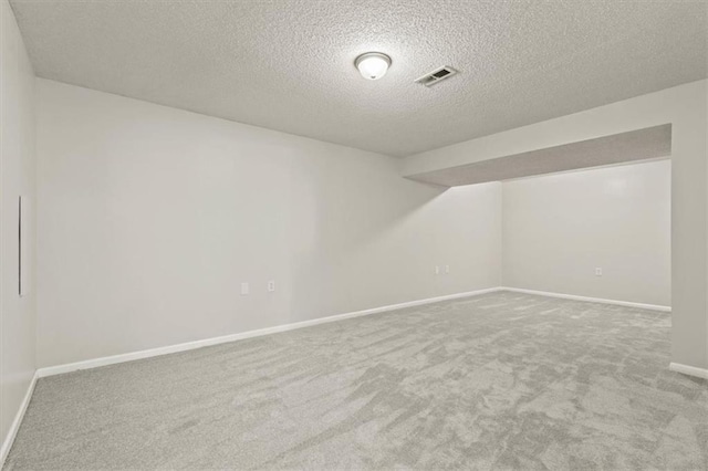 10118 E 220th St, Peculiar, MO 64078 - bonus room featuring carpet, a textured ceiling, and baseboards