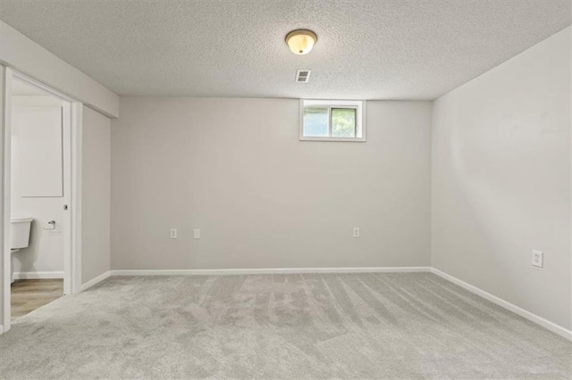 10118 E 220th St, Peculiar, MO 64078 - basement featuring carpet flooring, baseboards, and a textured ceiling