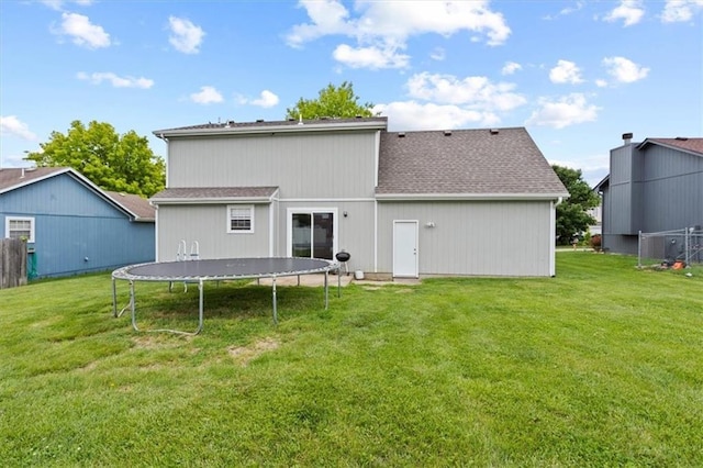 10118 E 220th St, Peculiar, MO 64078 - back of property featuring a trampoline and a shingled roof
