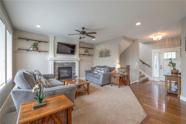 17304 S Schweiger Dr, Olathe, KS 66062 - living area with a fireplace, stairs, recessed lighting, baseboards, and wood finished floors