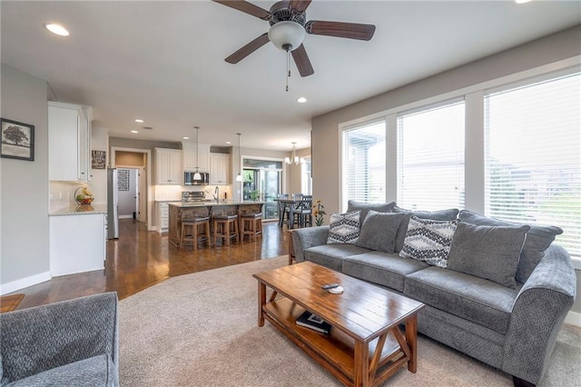 17304 S Schweiger Dr, Olathe, KS 66062 - living room featuring recessed lighting, a ceiling fan, dark wood-type flooring, and baseboards