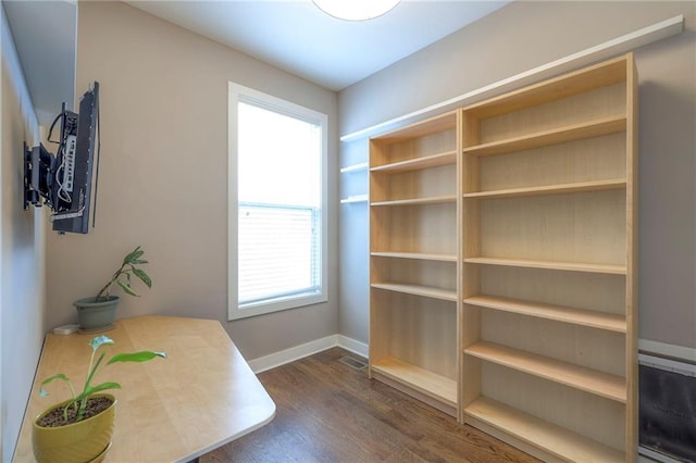 17304 S Schweiger Dr, Olathe, KS 66062 - home office with dark wood-type flooring and baseboards