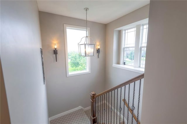 17304 S Schweiger Dr, Olathe, KS 66062 - stairs featuring a chandelier, carpet floors, and baseboards