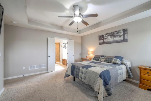 17304 S Schweiger Dr, Olathe, KS 66062 - bedroom with a tray ceiling, baseboards, carpet floors, and a ceiling fan
