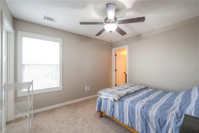 17304 S Schweiger Dr, Olathe, KS 66062 - carpeted bedroom with baseboards and a ceiling fan