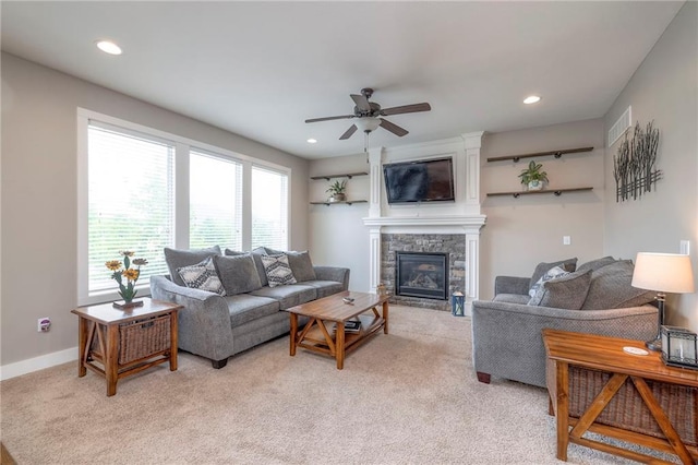 17304 S Schweiger Dr, Olathe, KS 66062 - living room with light carpet, a fireplace, ceiling fan, and recessed lighting