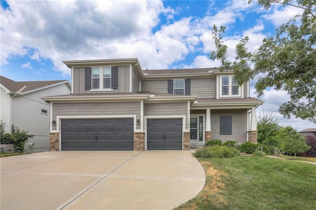 17304 S Schweiger Dr, Olathe, KS 66062 - view of front facade with stone siding, driveway, a front lawn, and an attached garage