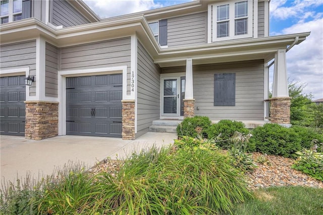 17304 S Schweiger Dr, Olathe, KS 66062 - view of front of home with concrete driveway, stone siding, and an attached garage